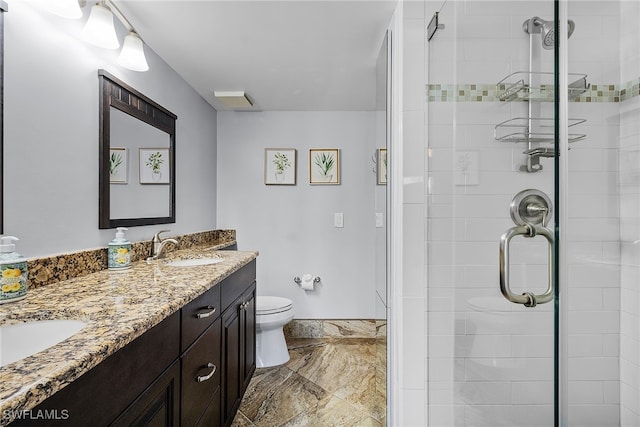 bathroom with vanity, toilet, and walk in shower