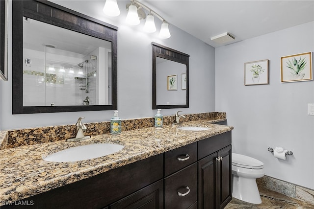 bathroom with vanity, an enclosed shower, and toilet