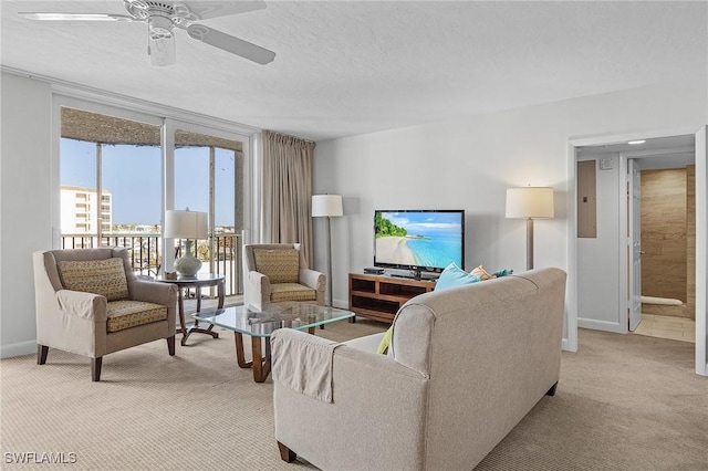 carpeted living room with electric panel, ceiling fan, and a textured ceiling