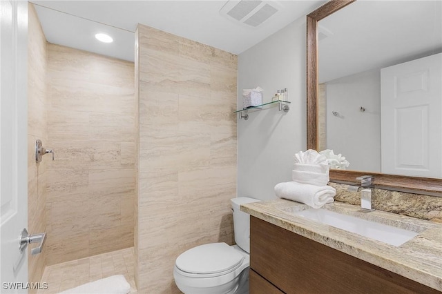 bathroom with vanity, toilet, and walk in shower