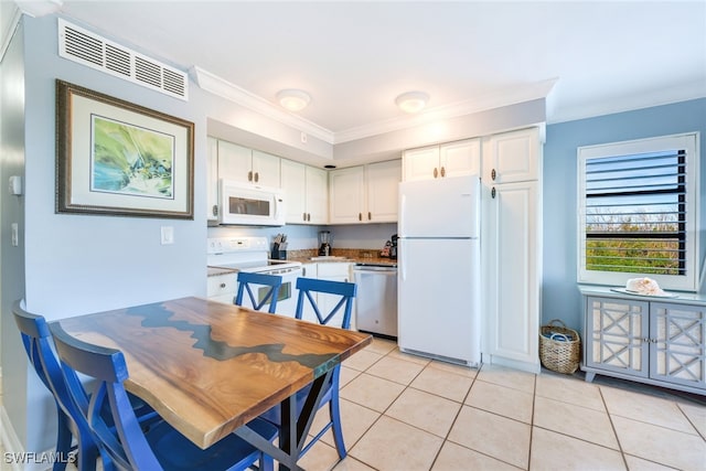 kitchen with white cabinets, white appliances, and ornamental molding