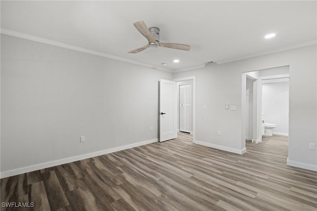 unfurnished bedroom featuring hardwood / wood-style flooring, ceiling fan, ornamental molding, and ensuite bathroom