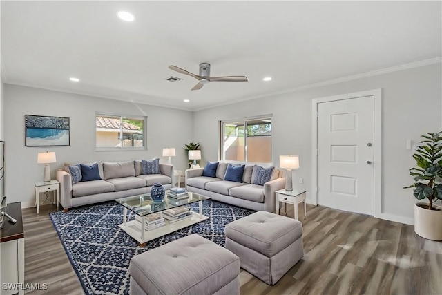 living room with wood-type flooring, ceiling fan, and crown molding