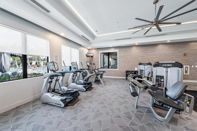 gym featuring carpet flooring and ceiling fan