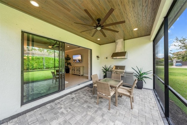 sunroom / solarium with ceiling fan and wood ceiling