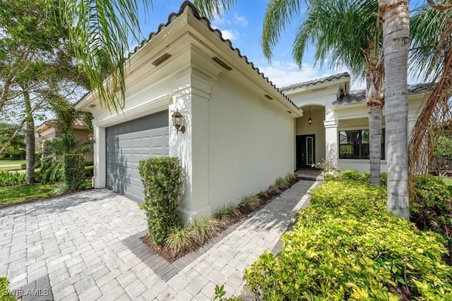 view of property exterior featuring a garage