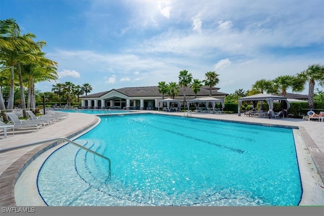 view of swimming pool featuring a gazebo and a patio area