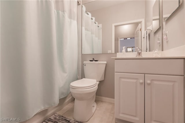 full bathroom with tile patterned floors, vanity, toilet, and shower / bath combo with shower curtain