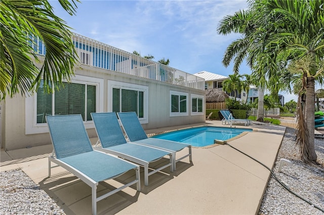 view of swimming pool featuring a patio