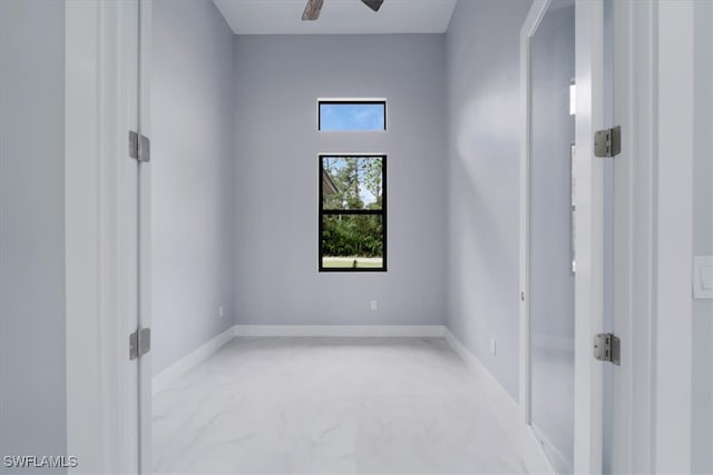 unfurnished room featuring ceiling fan