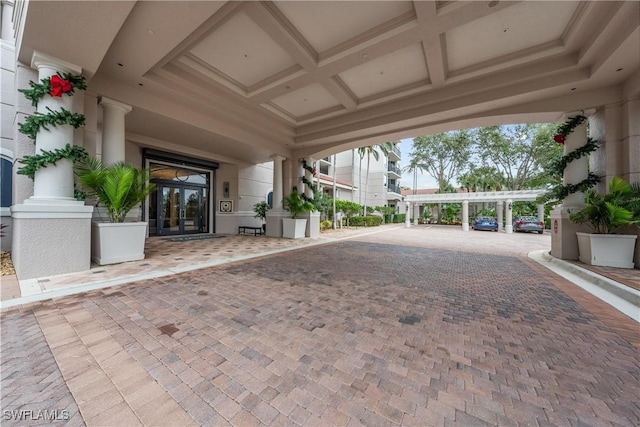 23540 Via Veneto Blvd Unit 605, Estero, FL 34134 - view of patio featuring french doors and decorative driveway