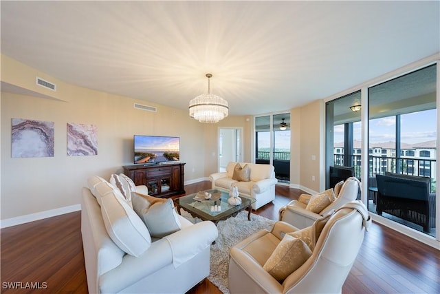 23540 Via Veneto Blvd Unit 605, Estero, FL 34134 - living area featuring dark wood-style flooring and baseboards