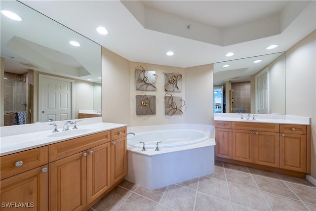 23540 Via Veneto Blvd Unit 605, Estero, FL 34134 - bathroom featuring two vanities, a stall shower, a bath, and recessed lighting