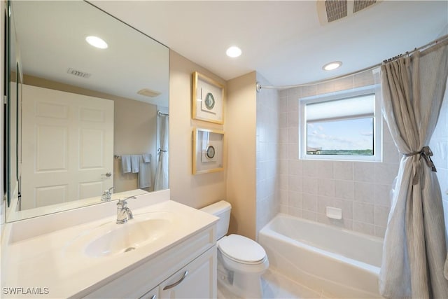 23540 Via Veneto Blvd Unit 605, Estero, FL 34134 - bathroom featuring toilet, vanity, shower / bath combo, and recessed lighting
