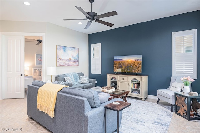 living room featuring light tile patterned floors and ceiling fan