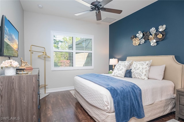 bedroom with ceiling fan and dark hardwood / wood-style floors