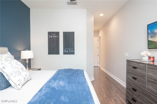 bedroom featuring dark hardwood / wood-style floors