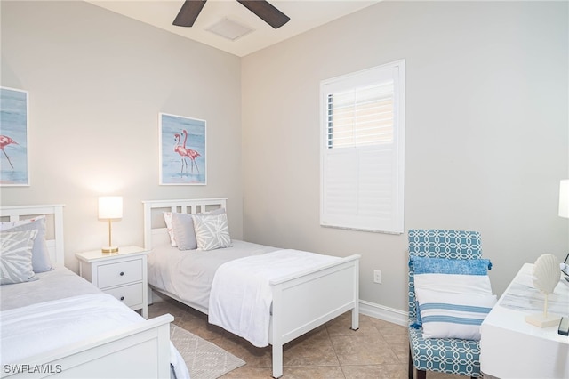 tiled bedroom featuring ceiling fan