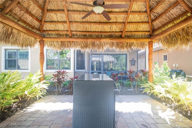 view of patio / terrace featuring a gazebo and ceiling fan