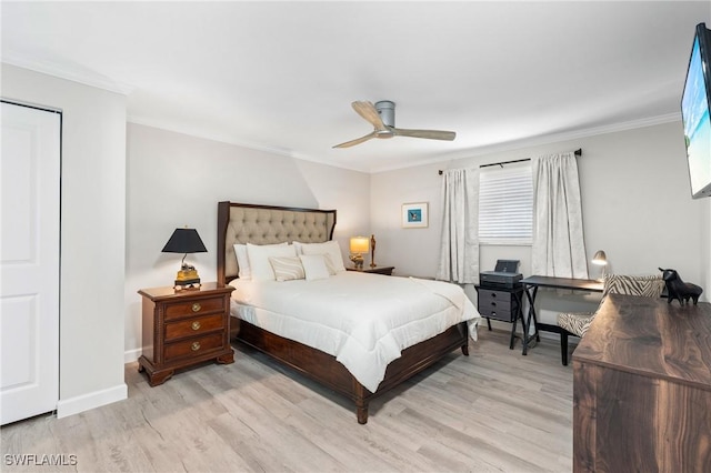 bedroom featuring light hardwood / wood-style flooring, ceiling fan, and ornamental molding