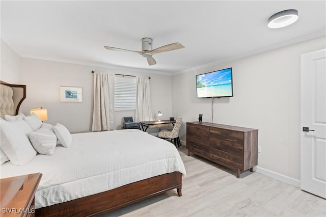 bedroom with ceiling fan, light hardwood / wood-style floors, and ornamental molding