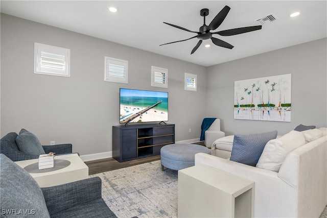 living room with ceiling fan, hardwood / wood-style floors, and a healthy amount of sunlight