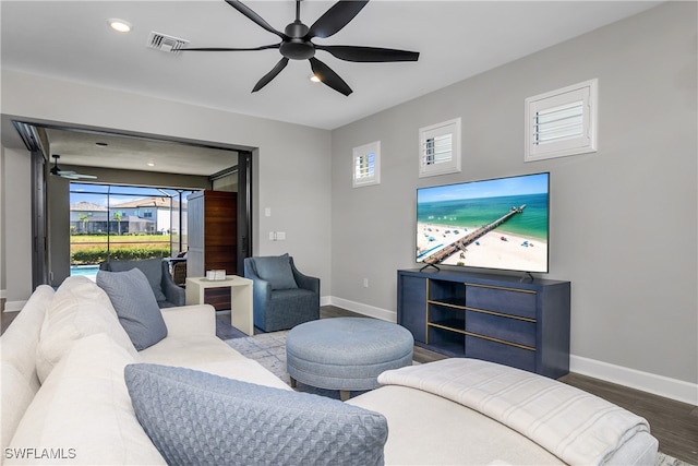 living room featuring hardwood / wood-style floors, plenty of natural light, and ceiling fan