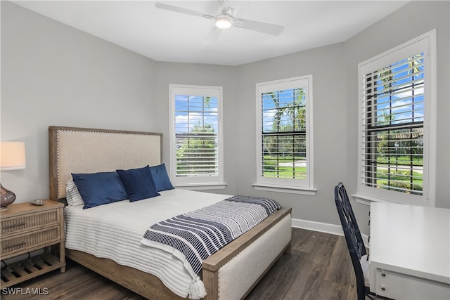 bedroom featuring ceiling fan and dark hardwood / wood-style flooring