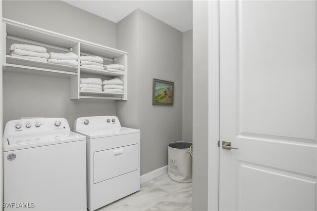 clothes washing area with independent washer and dryer