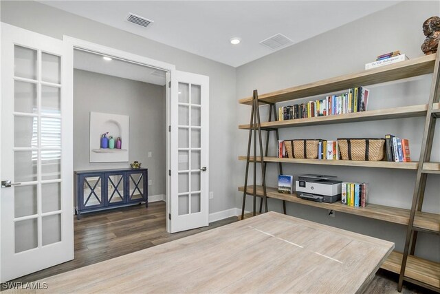 office with french doors and dark wood-type flooring