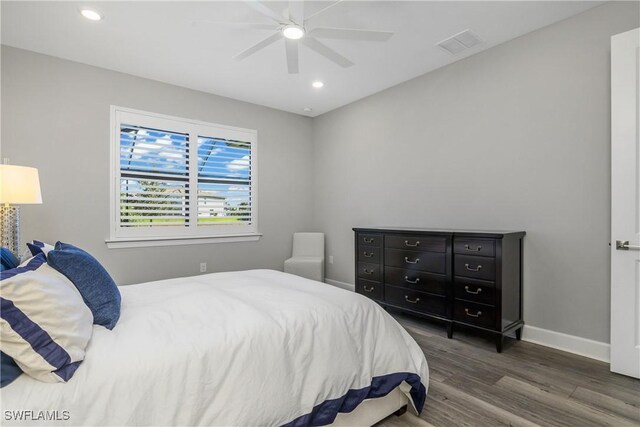 bedroom featuring ceiling fan and dark wood-type flooring