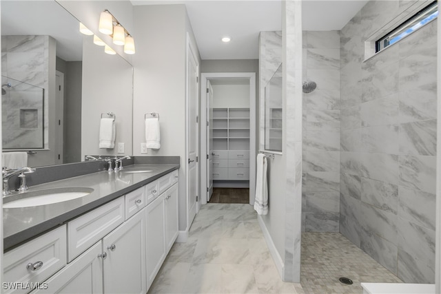 bathroom featuring vanity and a tile shower