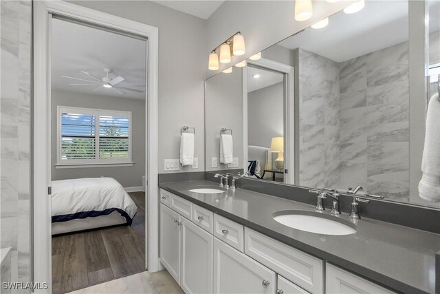 bathroom featuring ceiling fan, vanity, and hardwood / wood-style flooring