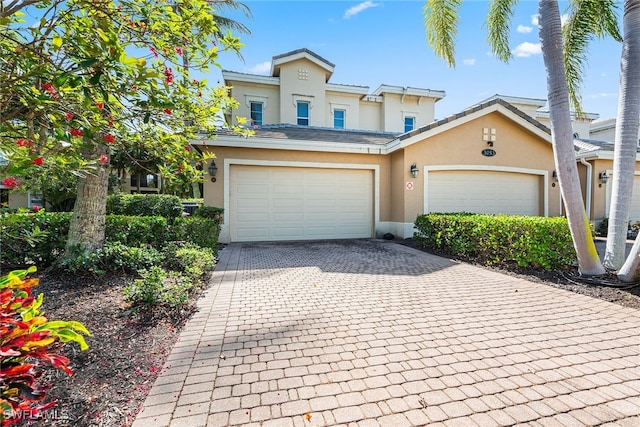 front facade with a garage