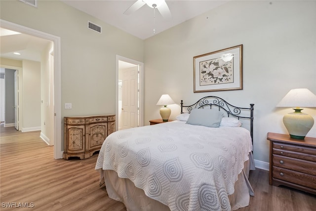 bedroom with ceiling fan and hardwood / wood-style floors