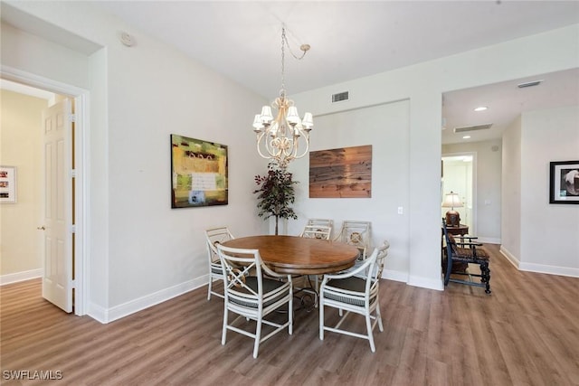 3053 Aviamar Cir Unit 101, Naples, FL 34114 - dining room featuring wood finished floors, baseboards, a chandelier, and recessed lighting