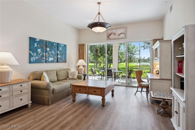 3053 Aviamar Cir Unit 101, Naples, FL 34114 - living area with wood finished floors