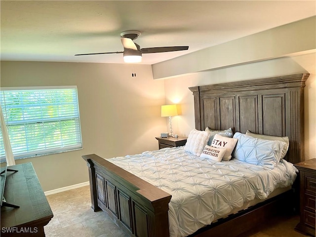 bedroom with light tile patterned floors and ceiling fan