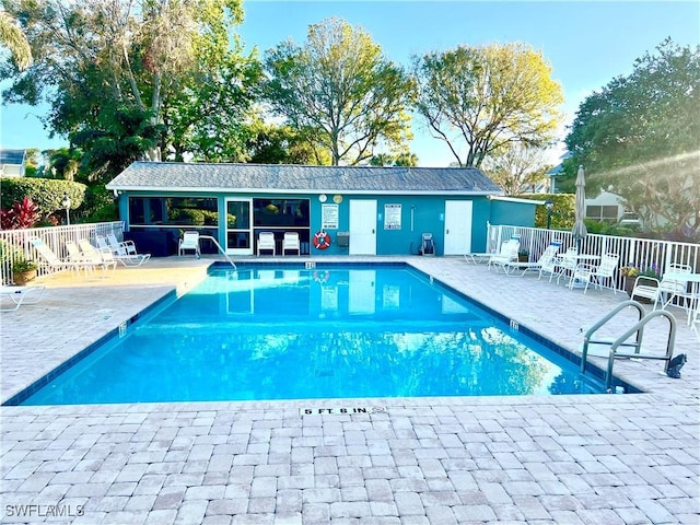 view of swimming pool with a patio area