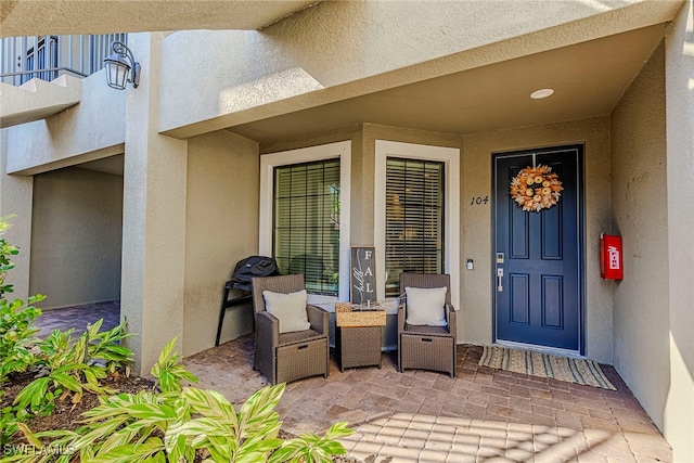 property entrance with a patio