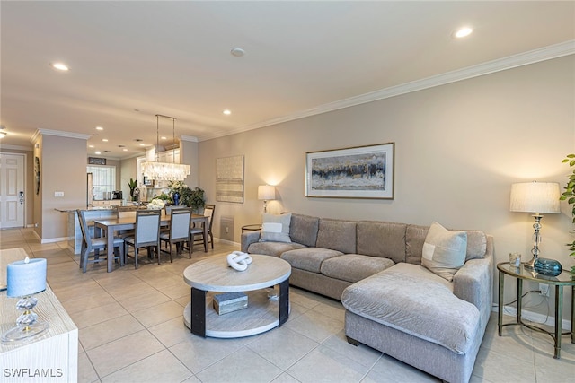 living room with light tile patterned floors and ornamental molding