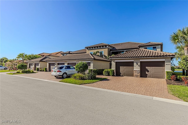 mediterranean / spanish house featuring a garage