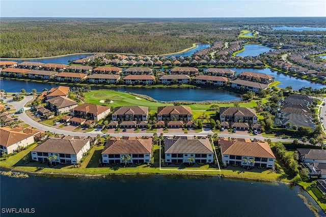 bird's eye view with a water view