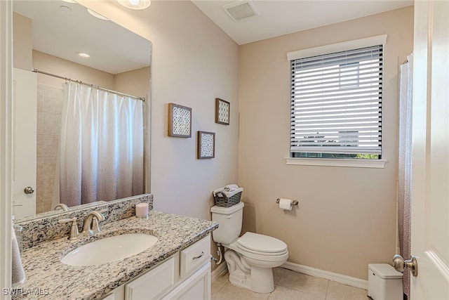 bathroom with tile patterned flooring, vanity, toilet, and curtained shower