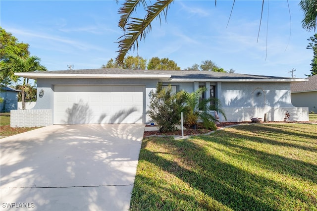 ranch-style home with a front lawn and a garage