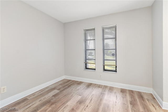 spare room with light hardwood / wood-style floors