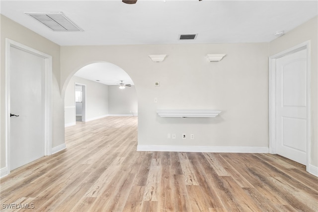 empty room with ceiling fan and light wood-type flooring