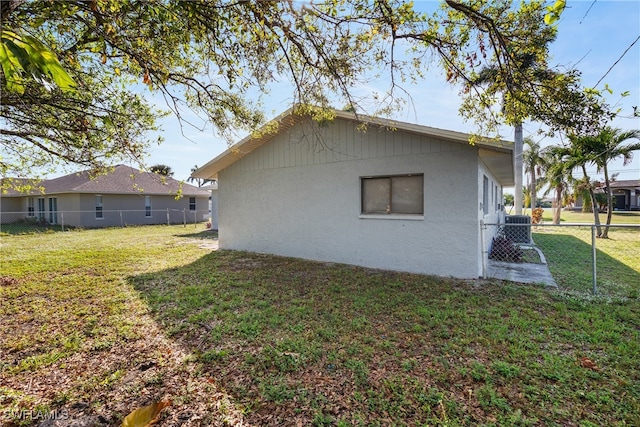 view of home's exterior with a yard