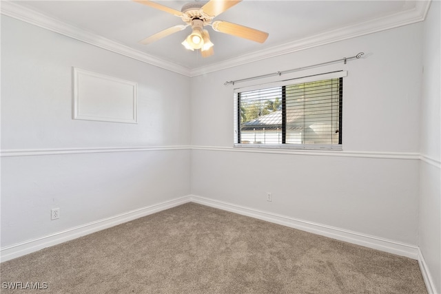 empty room with carpet, ceiling fan, and ornamental molding