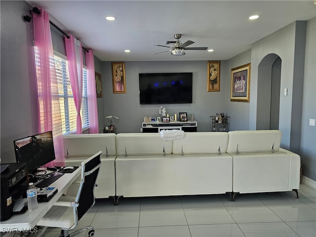 living room featuring tile patterned flooring and ceiling fan